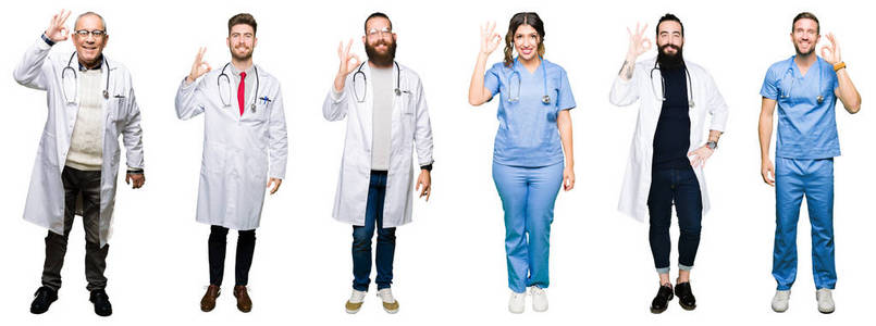 一群医生和外科医生的人在白色孤立的背景上微笑，积极地用手和手指做OK标志。成功的表达。
