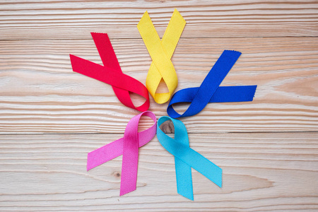  blue, red, pink and yellow color on wooden background  for supp