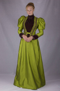 维多利亚时代的女人穿绿色丝绸套装