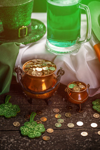 s Day cauldron of gold coins with irish flag, green beer, hat an