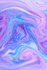 抽象五彩背景..粉红色蓝色的流体艺术。蓝色粉红色的纹理。液体中的彩色油漆污渍