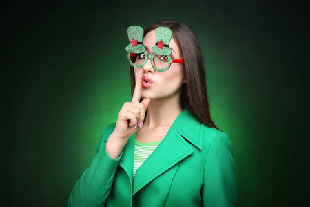 s Day. Beautiful woman wearing green glasses