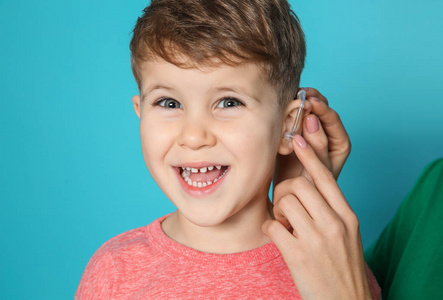 s hearing aid on color background, closeup