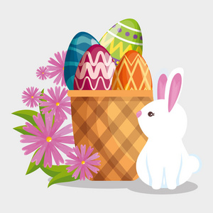 快乐的兔子和复活节彩蛋在篮子里