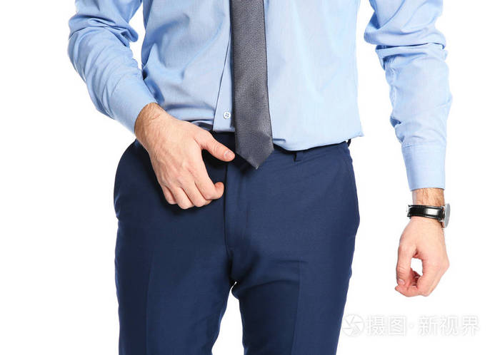 男人在白色背景上抓裆特写烦人的痒