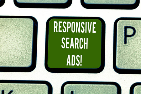 显示响应式搜索广告的文本符号。概念照片增加您的广告显示键盘键意图以创建按键盘的计算机消息的可能性