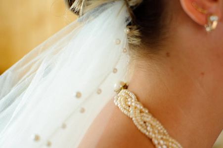 s neck. Morning preparation of the bride.