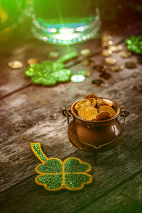 s Day concept with shamrock leaves and pot of coins