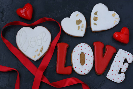 Homemade gingerbreads in the shape of hearts and the letters qu
