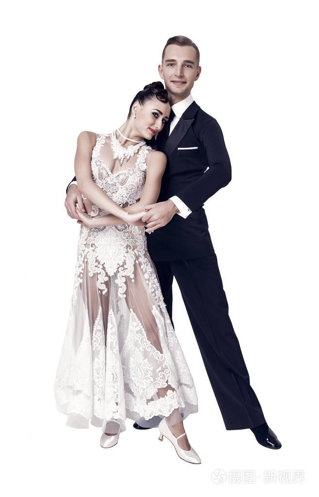 性感的女人和男人跳舞新娘穿着白色礼服新郎穿着燕尾服两个舞厅舞者