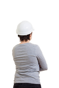 后视图的年轻女子工程师戴着保护头盔隔离在白色背景。