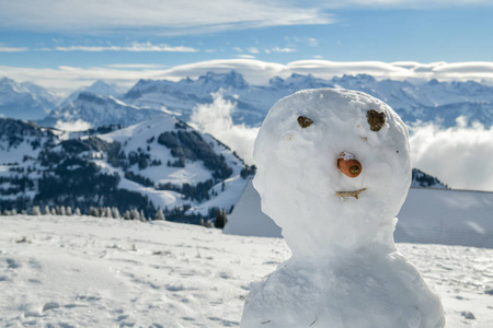 s face on top of Mount Rigi with amazing view on Swiss Alps