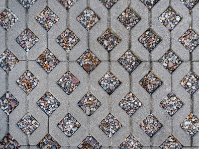 混凝土路面瓷砖纹理背景卵石之间的方形图案照片