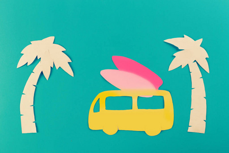 冲浪概念图像，冲浪板和棕榈树。剪纸