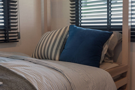 s bedroom in blue color tone with wooden bed, interior decoratio