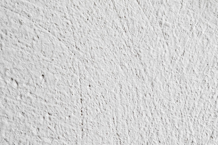 背景纹理白色混凝土墙。 表面上的小裂缝。