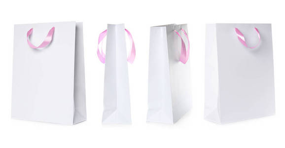 一套纸袋，用于白色背景下购物。 设计模型