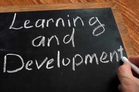 D Learning and Development written by hand on blackboard.