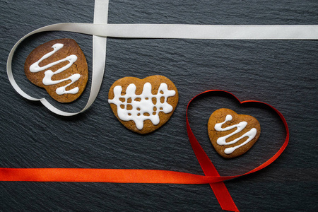 s Day. Heartshaped ribbons with handmade heartshaped cookies w