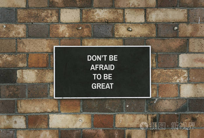 t be afraid to be great board mockup on a brick wall