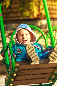 s entertainment complex with swing, sandbox, carousel and slides