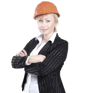 微笑的女建筑师在橙色的头盔. 隔离在白色