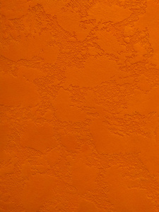 装饰石膏背景的橙色纹理墙