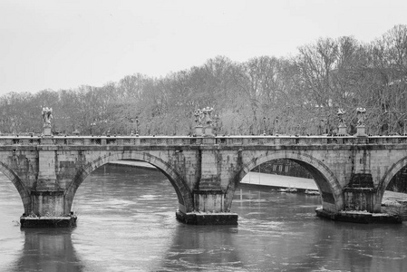 Angelo and the Tiber River in the snow, in Rome, Italy