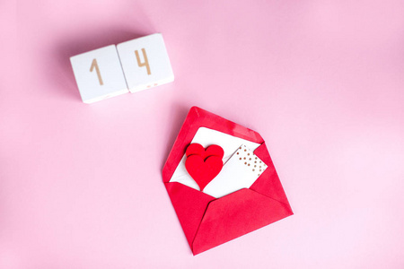 s day concept. Valentine, hearts, wooden cubes with numbers on a