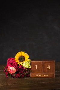 s Day vintage wooden Perpetual calendar for February 14 on a bla