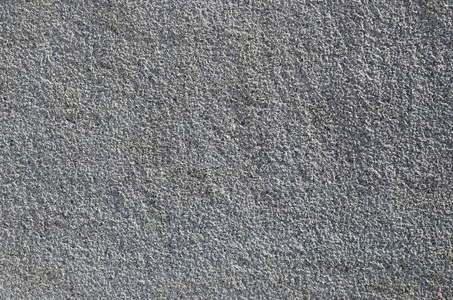 浮雕墙粗糙混凝土墙的纹理与浮雕纹理. 光滑的灰色表面照片