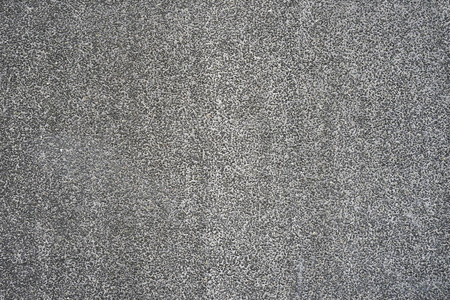 抽象小石混凝土水泥地板纹理背景。 卵石的质地。 小石头的墙。 墙上的小石头背景不寻常的纹理。 小小的灰色卵石纹理。