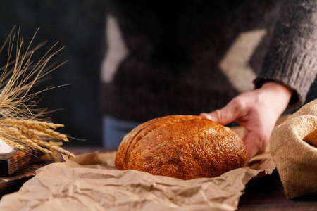 s hand. The concept of healthy food and traditional bakery. Rust