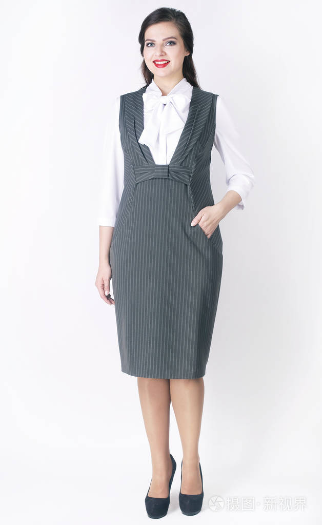 侧面视图.时尚女模特在商务礼服. 加大小
