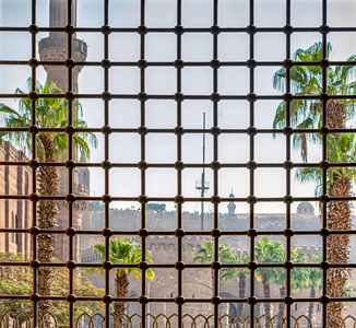 s rays fall into the window through the iron lattice