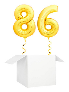 金黄数字86金黄的充气气球与金黄丝带飞行出空白白色箱子查出在白色