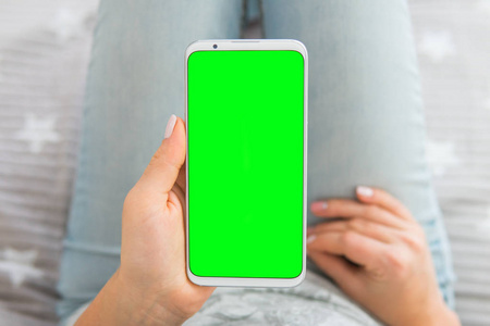 模拟图像的女人的手的关键智能手机绿色屏幕持有色度顶部视图手机