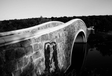  shadows  hands in the shape of a heart  on the bridge