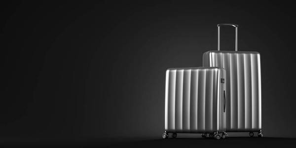 两个时尚的银色手提箱站在黑色背景上。 旅游和旅游的概念。 3D渲染模拟
