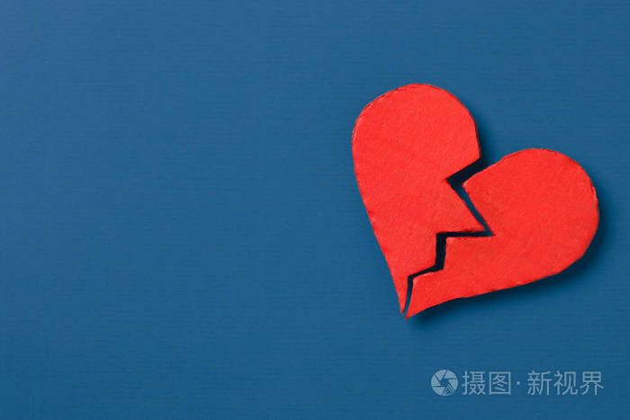 s Day. Broken heart with copy space on blue background