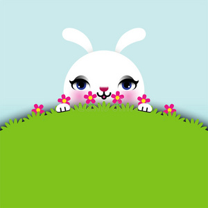 复活节兔子坐在草地上