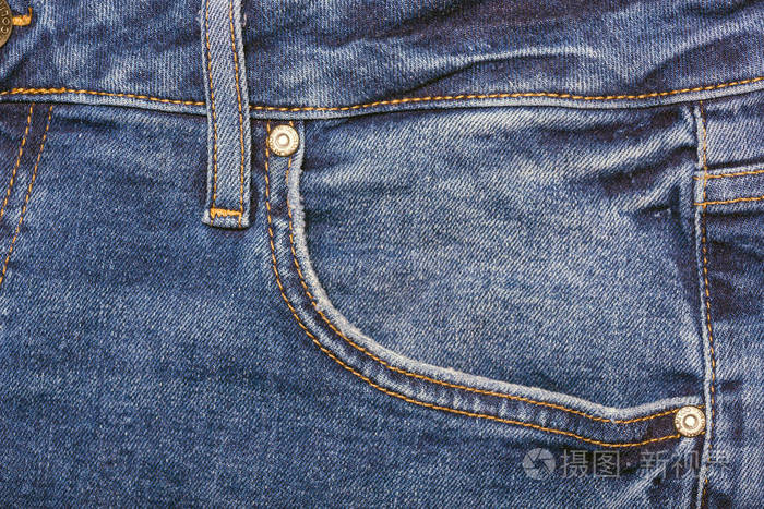 蓝色牛仔裤。 复古蓝色牛仔裤纹理细节与口袋。口袋牛仔裤牛仔时尚背景
