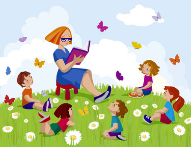 一群孩子围着老师坐在一起听故事.照片