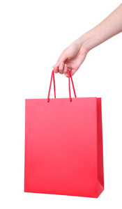 女性手拿红色购物袋，白色背景隔离