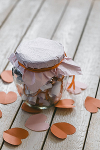 s day concept. Date Jar with desires or wishes. Red paper hearts