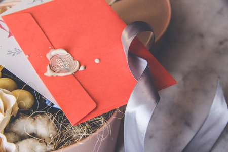 s day concept. Pink envelope, white sealing wax, postcard, note