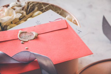 s day concept. Pink envelope, white sealing wax, postcard, note