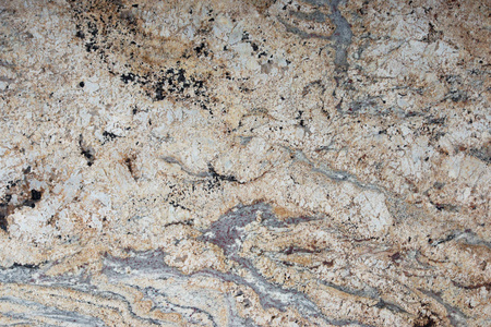 米色花岗岩，表面有花纹，称为金色瀑布，石材纹理，大理石背景
