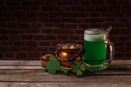 s Day concept with green beer and cauldron of gold, space for yo