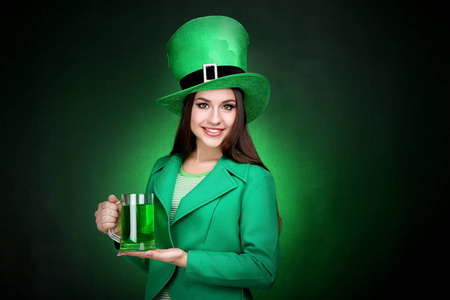 s Day. Beautiful woman wearing green hat with beer